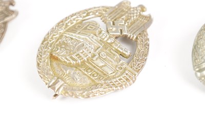Lot 548 - A COLLECTION OF THREE WW2 GERMAN THIRD REICH SILVER AND SILVER METAL PANZER ASSAULT BADGES