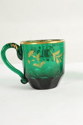 Lot 10 - A PAIR OF LATE GEORGIAN BRISTOL GREEN GLASS CUPS IN THE MANNER OF JAMES GILES