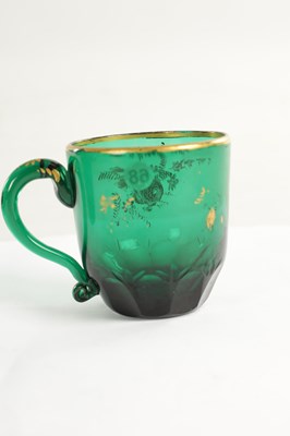 Lot 10 - A PAIR OF LATE GEORGIAN BRISTOL GREEN GLASS CUPS IN THE MANNER OF JAMES GILES