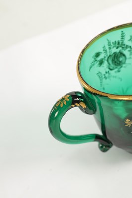 Lot 10 - A PAIR OF LATE GEORGIAN BRISTOL GREEN GLASS CUPS IN THE MANNER OF JAMES GILES