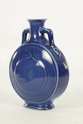 Lot 147 - A 19TH CENTURY BLUE GLAZED CHINESE MOON FLASK