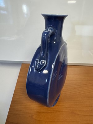 Lot 147 - A 19TH CENTURY BLUE GLAZED CHINESE MOON FLASK