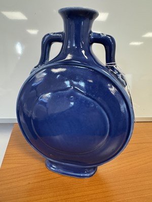 Lot 147 - A 19TH CENTURY BLUE GLAZED CHINESE MOON FLASK