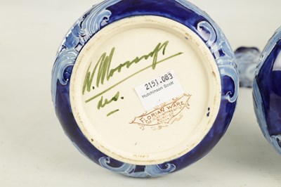 Lot 46 - A PAIR OF LATE 19TH CENTURY MOORCROFT FLORIAN WARE CABINET VASES