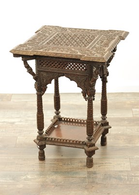 Lot 284 - A 19TH CENTURY INDIAN PROFUSELY CARVED HARDWOOD CENTRE TABLE