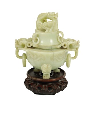 Lot 176 - A LARGE CHINESE CARVED JADE KORO AND COVER ON HARDWOOD STAND