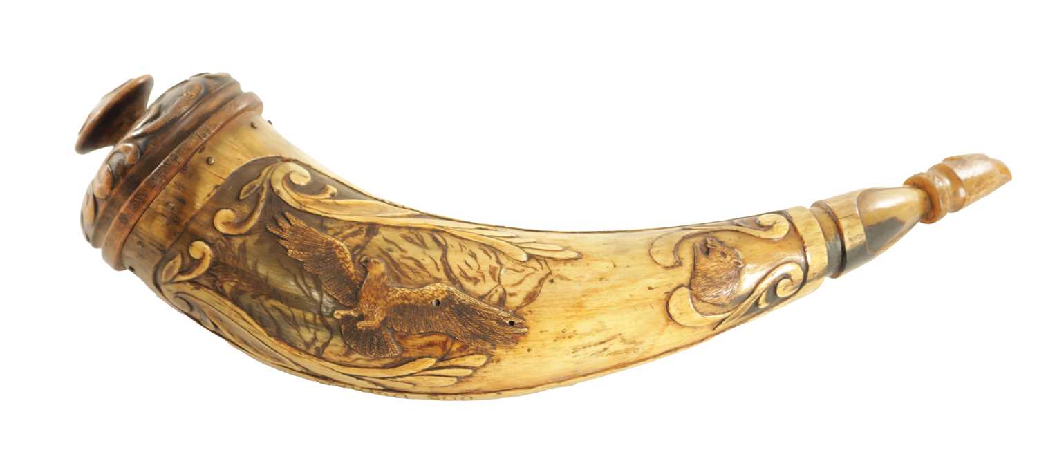 Lot 556 - AN UNUSUAL 19TH CENTURY AMERICAN CARVED HORN POWDER FLASK