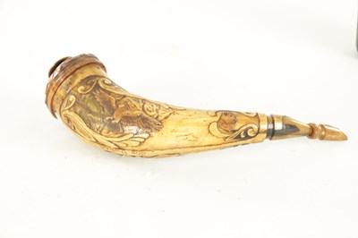 Lot 556 - AN UNUSUAL 19TH CENTURY AMERICAN CARVED HORN POWDER FLASK