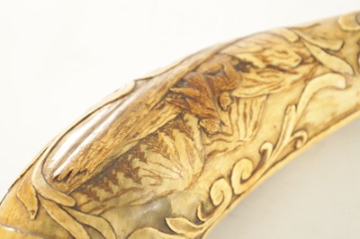 Lot 556 - AN UNUSUAL 19TH CENTURY AMERICAN CARVED HORN POWDER FLASK