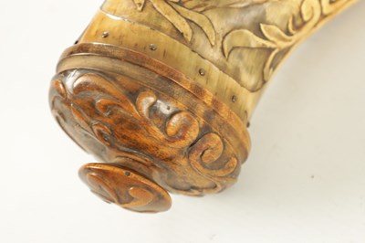 Lot 556 - AN UNUSUAL 19TH CENTURY AMERICAN CARVED HORN POWDER FLASK