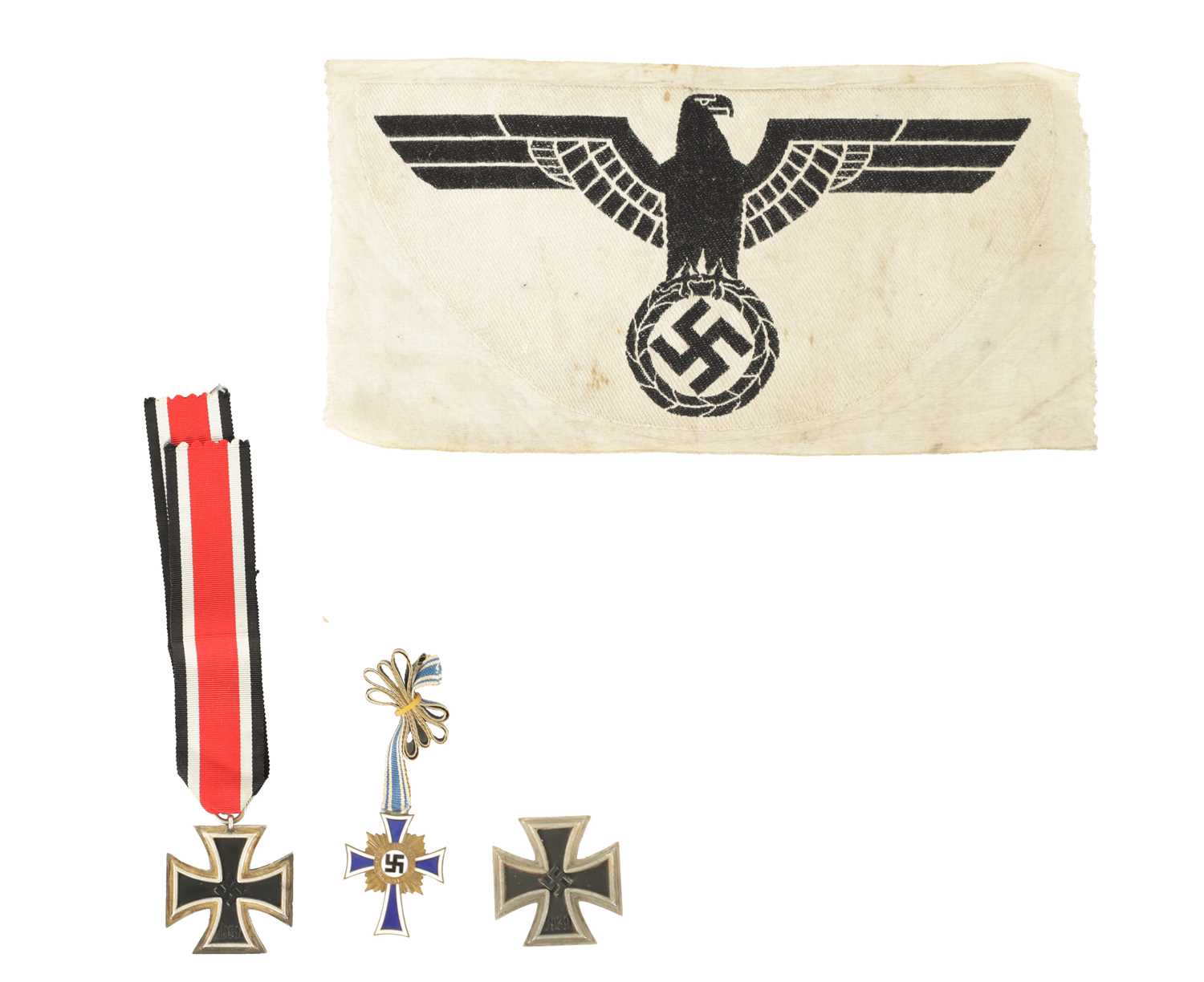 Lot 547 - THREE WWII GERMAN NAZI MEDALS AND AN EMBROIDERED INSIGNIA