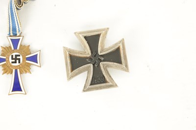 Lot 547 - THREE WWII GERMAN NAZI MEDALS AND AN EMBROIDERED INSIGNIA