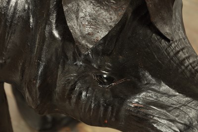 Lot 628 - A LARGE LIBERTY STYLE LEATHER BOUND MODEL OF A RHINO