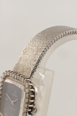 Lot 1412 - A LADIES 18CT WHITE GOLD AND DIAMOND SET OMEGA DE VILLE WRIST WATCH