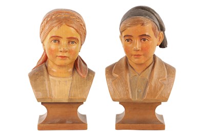 Lot ATT. HANS HUGGLER WYSS. A PAIR OF SWISS CARVED PAINTE WOODEN BUSTS