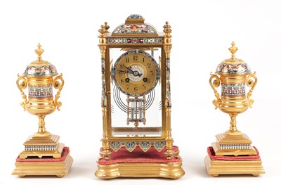 Lot A LATE 19TH CENTURY FRENCH ORMOLU AND CHAMPLEVE ENAMEL CLOCK GARNITURE