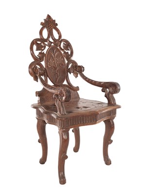 Lot A 19TH CENTURY BLACK FOREST CARVED WALNUT CHILDS CHAIR BY EMILE EGGER