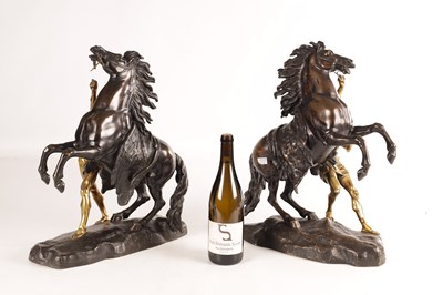Lot 878 - A LARGE PAIR OF 19TH CENTURY BRONZE AND GILT BRONZE MARLEY HORSES