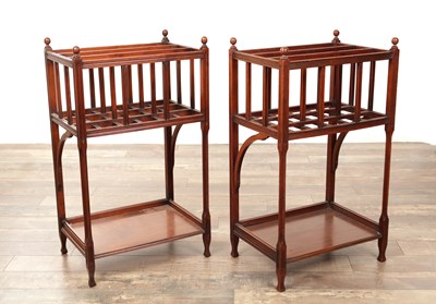 Lot A PAIR OF ARTS AND CRAFTS MAHOGANY CANTERBURYS