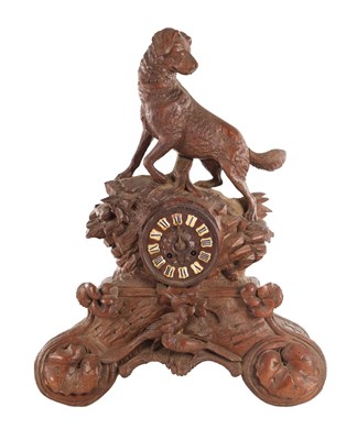 Lot A LATE 19TH CENTURY BLACK FOREST CARVED LINDEN WOOD MANTEL CLOCK