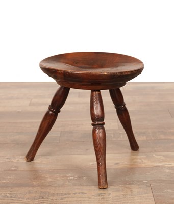 Lot AN 18TH CENTURY FRUITWOOD DISHED STOOL