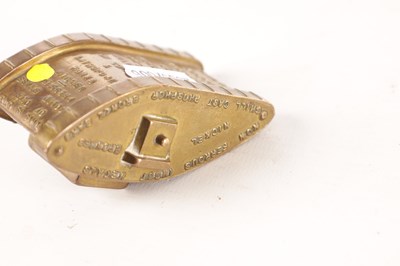 Lot 955 - AN EARLY 20TH CENTURY CAST BRASS PAPER WEIGHT FORMED AS A WORLD WAR I TANK