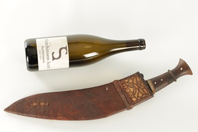 Lot 663 - A 19TH CENTURY NEPALESE MACHETTI WITH LEAF ENGRAVED STEEL BLADE AND RIVETED ROSEWOOD HANDLE