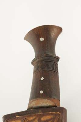 Lot 663 - A 19TH CENTURY NEPALESE MACHETTI WITH LEAF ENGRAVED STEEL BLADE AND RIVETED ROSEWOOD HANDLE