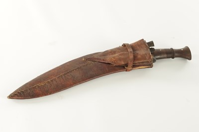 Lot 663 - A 19TH CENTURY NEPALESE MACHETTI WITH LEAF ENGRAVED STEEL BLADE AND RIVETED ROSEWOOD HANDLE