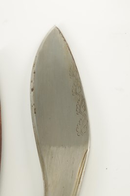 Lot 663 - A 19TH CENTURY NEPALESE MACHETTI WITH LEAF ENGRAVED STEEL BLADE AND RIVETED ROSEWOOD HANDLE