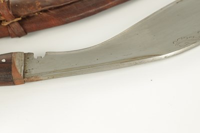 Lot 663 - A 19TH CENTURY NEPALESE MACHETTI WITH LEAF ENGRAVED STEEL BLADE AND RIVETED ROSEWOOD HANDLE