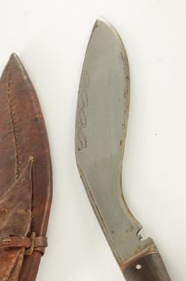 Lot 663 - A 19TH CENTURY NEPALESE MACHETTI WITH LEAF ENGRAVED STEEL BLADE AND RIVETED ROSEWOOD HANDLE