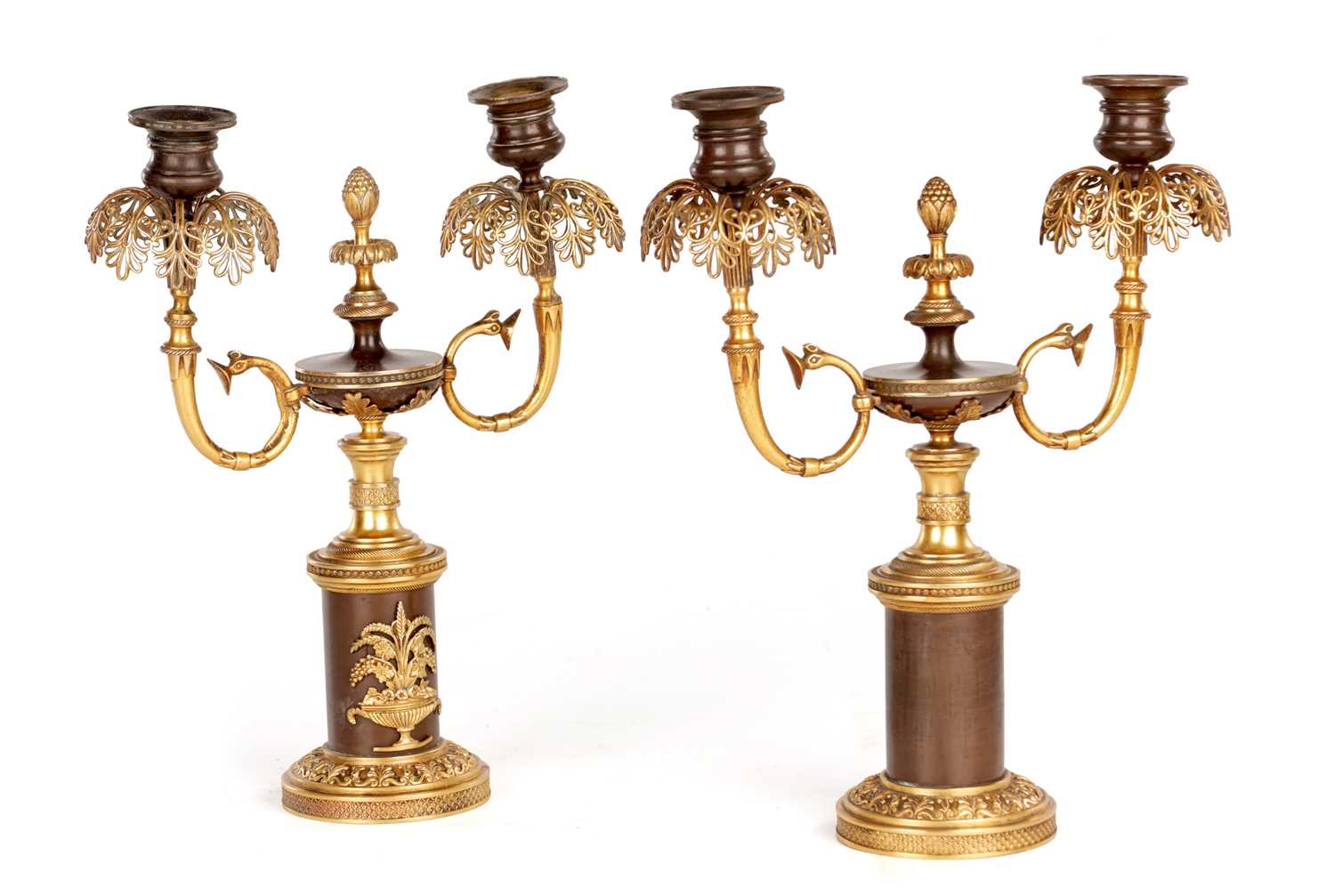 Lot 730 - A PAIR OF REGENCY FRENCH BRONZE AND GILT BRONZE TWO BRANCH CANDELABRA