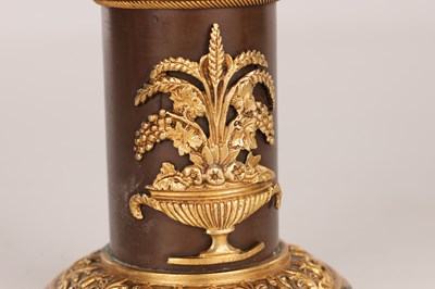 Lot 730 - A PAIR OF REGENCY FRENCH BRONZE AND GILT BRONZE TWO BRANCH CANDELABRA
