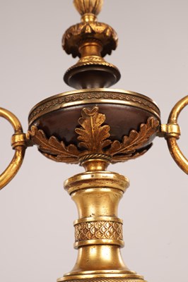 Lot 730 - A PAIR OF REGENCY FRENCH BRONZE AND GILT BRONZE TWO BRANCH CANDELABRA