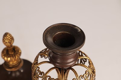 Lot 730 - A PAIR OF REGENCY FRENCH BRONZE AND GILT BRONZE TWO BRANCH CANDELABRA