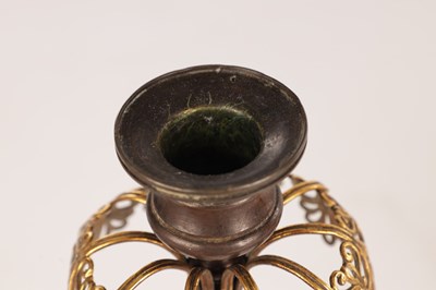 Lot 730 - A PAIR OF REGENCY FRENCH BRONZE AND GILT BRONZE TWO BRANCH CANDELABRA