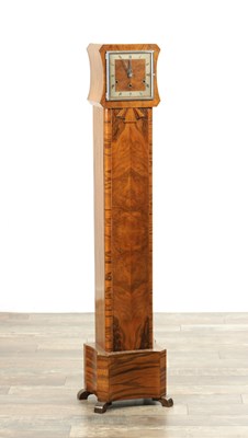 Lot 1471 - AN ART DECO FIGURED WALNUT GRANDDAUGHTER CLOCK
