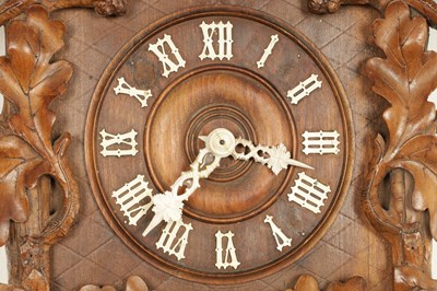Lot 1322 - A LATE 19TH CENTURY GERMAN BLACK FOREST CARVED LINDEN WOOD THREE TRAIN CUCKOO QUAIL CLOCK