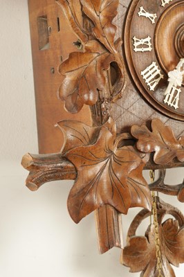 Lot 1322 - A LATE 19TH CENTURY GERMAN BLACK FOREST CARVED LINDEN WOOD THREE TRAIN CUCKOO QUAIL CLOCK