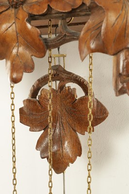 Lot 1322 - A LATE 19TH CENTURY GERMAN BLACK FOREST CARVED LINDEN WOOD THREE TRAIN CUCKOO QUAIL CLOCK