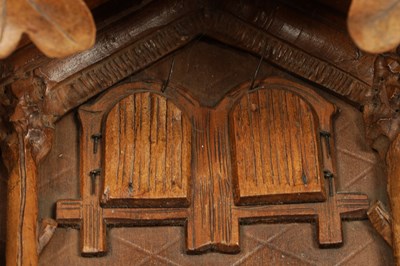 Lot 1322 - A LATE 19TH CENTURY GERMAN BLACK FOREST CARVED LINDEN WOOD THREE TRAIN CUCKOO QUAIL CLOCK