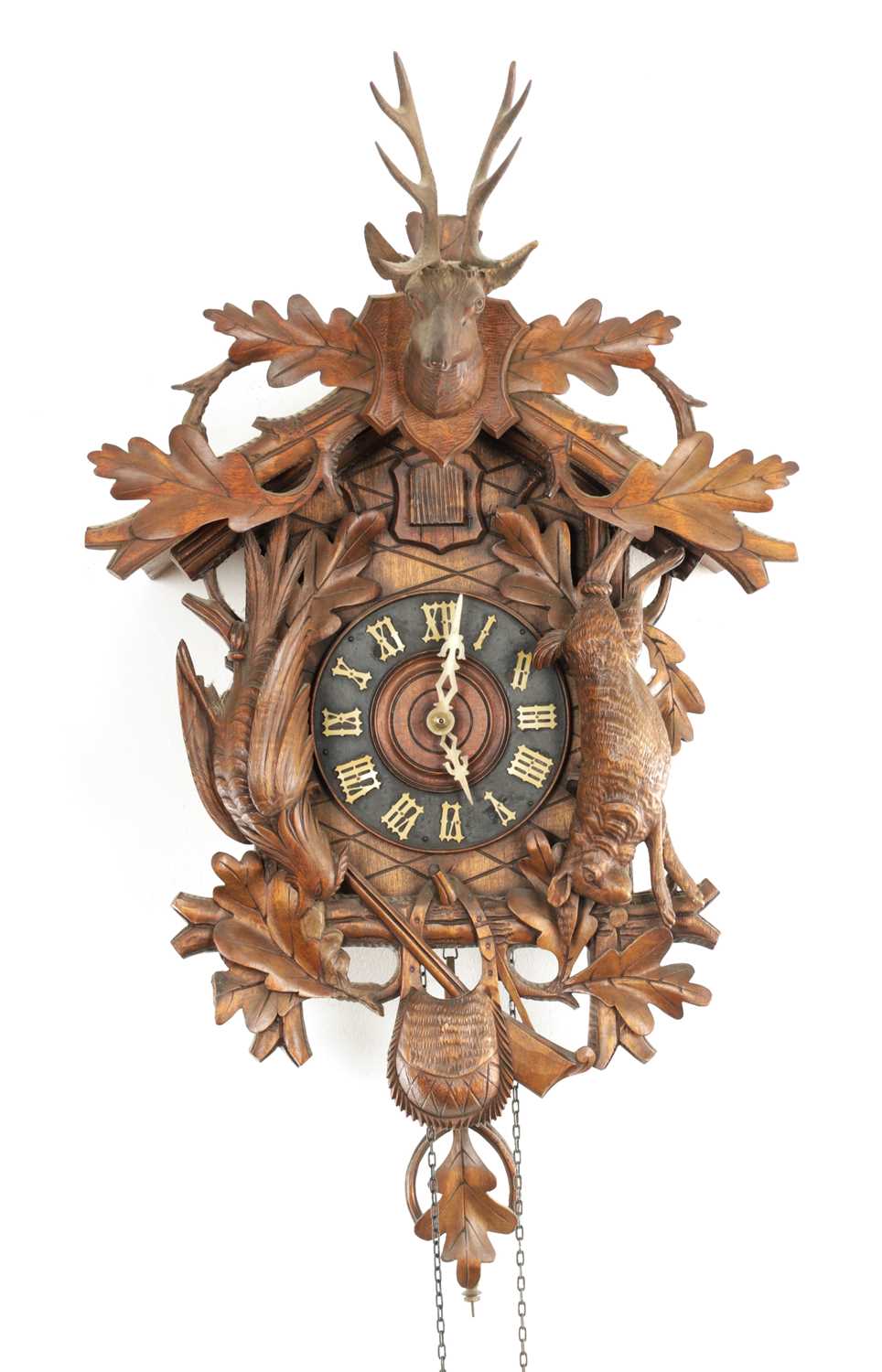 Lot 285 - A LATE 19TH CENTURY GERMAN BLACK FOREST CARVED LINDEN WOOD CUCKOO CLOCK