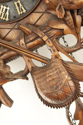 Lot 285 - A LATE 19TH CENTURY GERMAN BLACK FOREST CARVED LINDEN WOOD CUCKOO CLOCK