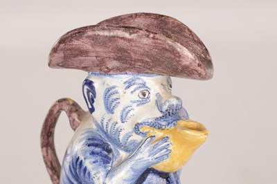 Lot 112 - A 19TH CENTURY DUTCH DELFT TOBY JUG MODELLED AS A MONKEY