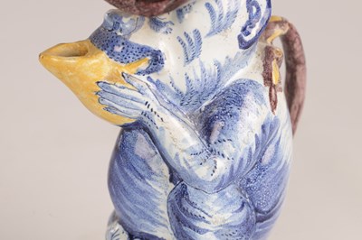 Lot 112 - A 19TH CENTURY DUTCH DELFT TOBY JUG MODELLED AS A MONKEY