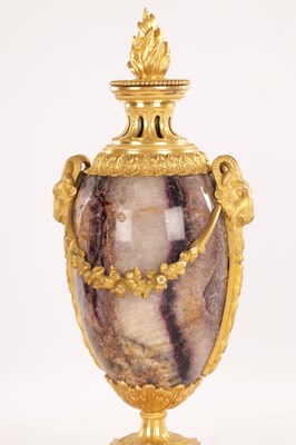 Lot 834 - A FINE PAIR OF LATE GEORGE III ORMOLU AND BLUE JOHN MANTEL URNS/CANDLE HOLDERS ON VEINED PINK MARBLE PEDESTAL BASES ATTRIBUTED TO MATTHEW BOULTON