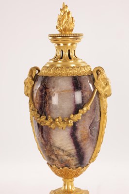 Lot 834 - A FINE PAIR OF LATE GEORGE III ORMOLU AND BLUE JOHN MANTEL URNS/CANDLE HOLDERS ON VEINED PINK MARBLE PEDESTAL BASES ATTRIBUTED TO MATTHEW BOULTON