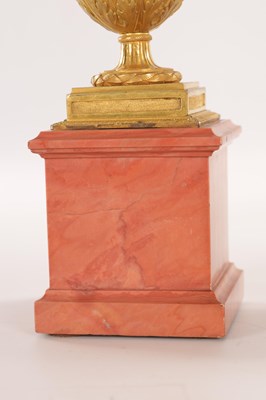 Lot 834 - A FINE PAIR OF LATE GEORGE III ORMOLU AND BLUE JOHN MANTEL URNS/CANDLE HOLDERS ON VEINED PINK MARBLE PEDESTAL BASES ATTRIBUTED TO MATTHEW BOULTON