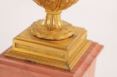 Lot 834 - A FINE PAIR OF LATE GEORGE III ORMOLU AND BLUE JOHN MANTEL URNS/CANDLE HOLDERS ON VEINED PINK MARBLE PEDESTAL BASES ATTRIBUTED TO MATTHEW BOULTON